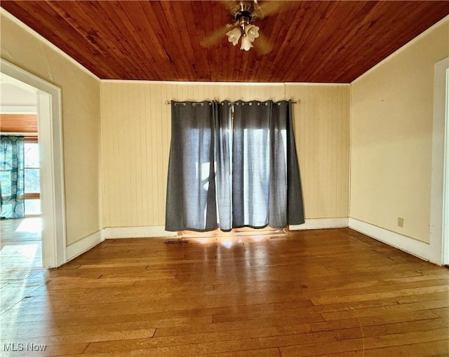 unfurnished room with hardwood / wood-style floors, wooden ceiling, and ceiling fan