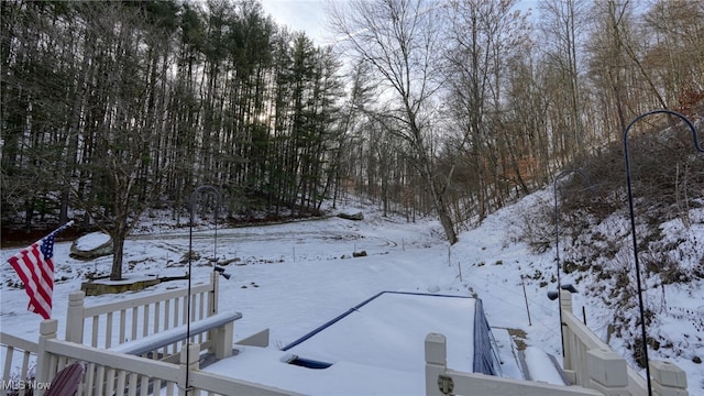 view of yard layered in snow