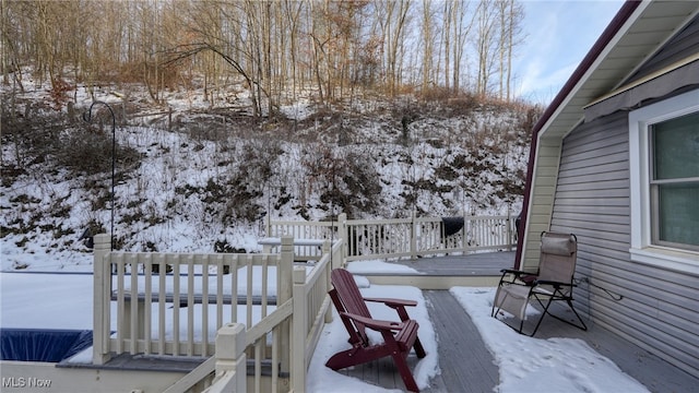 view of snow covered deck