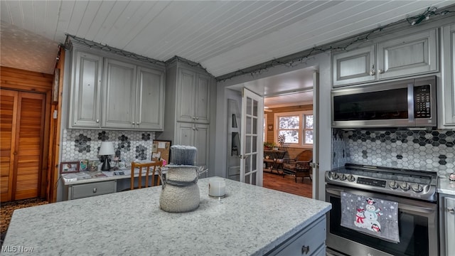 2250 Indian Camp Run Rd, New Concord, OH 43762 - kitchen featuring french doors, gray cabinets, decorative backsplash, and stainless steel appliances