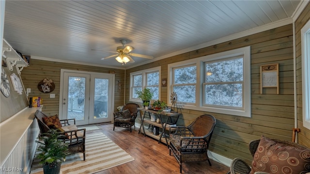 sunroom / solarium featuring wood ceiling and ceiling fan