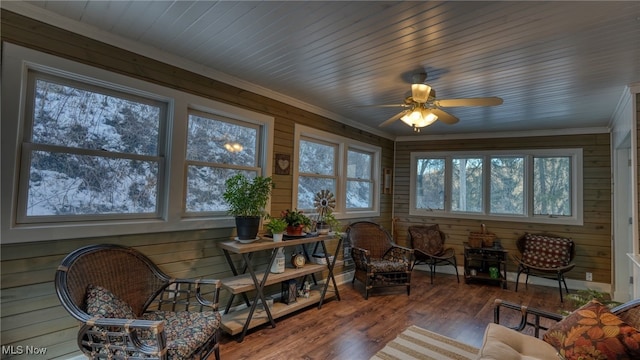 sunroom / solarium with wooden ceiling and ceiling fan