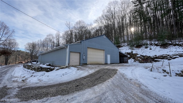 view of snow covered garage