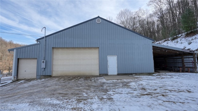 view of snow covered garage