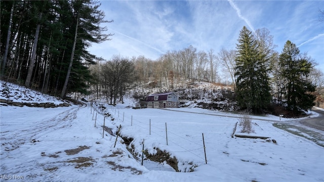 view of yard layered in snow