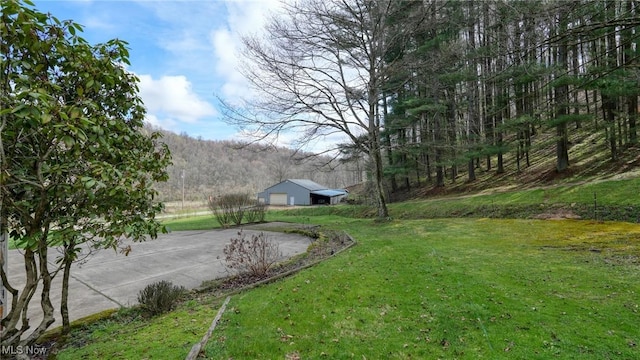 2250 Indian Camp Run Rd, New Concord, OH 43762 - view of yard with a wooded view and an outdoor structure
