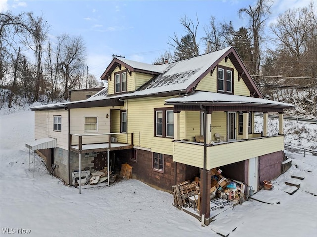 view of snow covered house