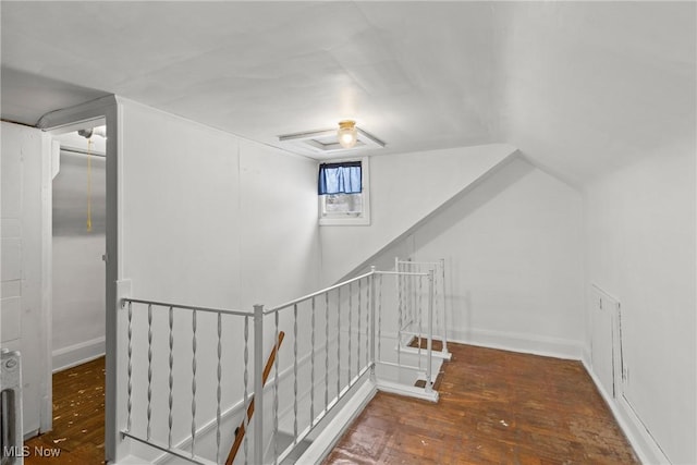 staircase with hardwood / wood-style flooring