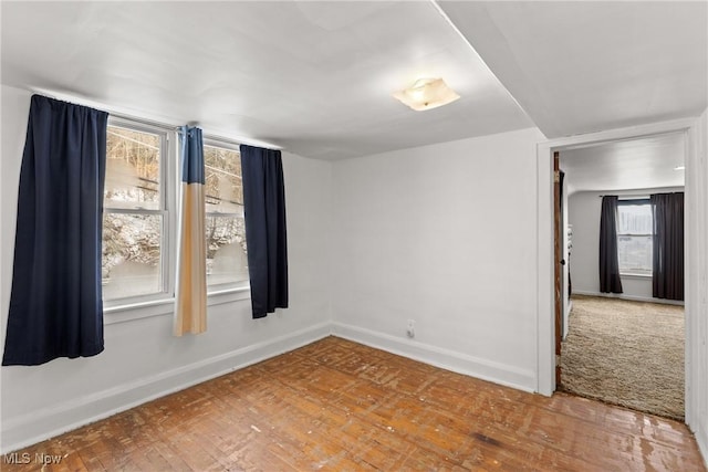 empty room with hardwood / wood-style flooring