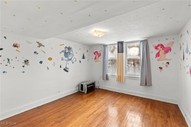 empty room featuring wood-type flooring