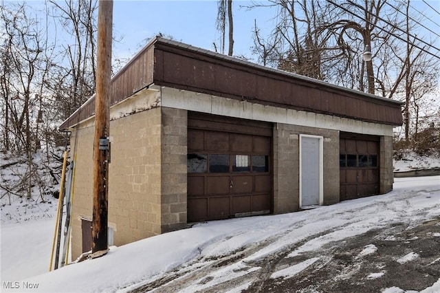 view of snow covered garage