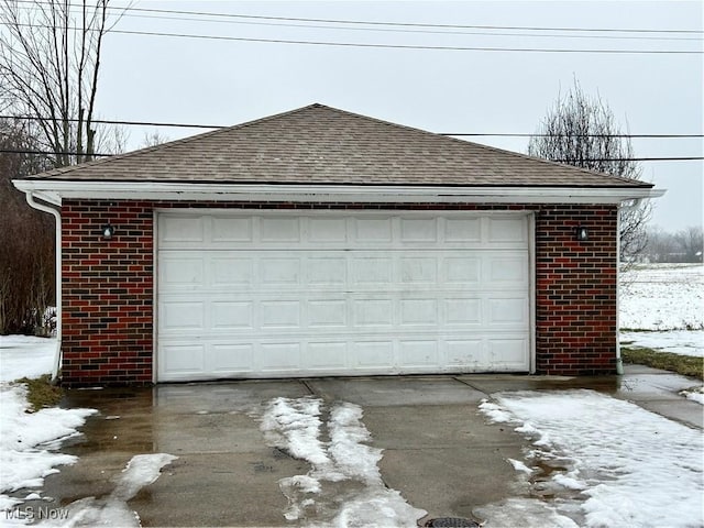 view of snow covered garage