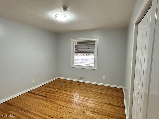 unfurnished room featuring light hardwood / wood-style floors