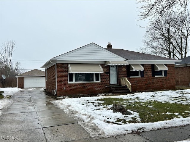 view of front of property featuring an outbuilding and a garage