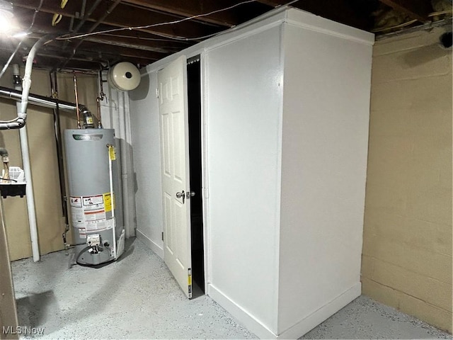 utility room with water heater