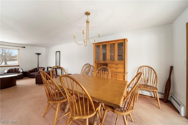 dining room featuring light carpet and a notable chandelier