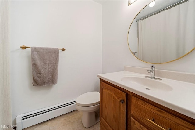 bathroom with tile patterned flooring, vanity, baseboard heating, and toilet