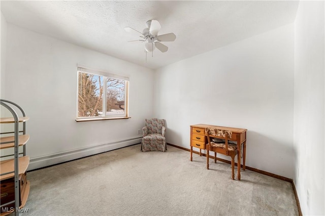 sitting room featuring carpet floors, a textured ceiling, a baseboard radiator, and ceiling fan