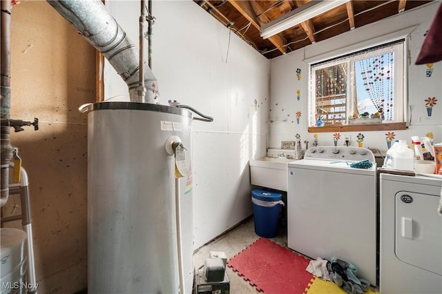 laundry room with washer and clothes dryer, sink, and water heater