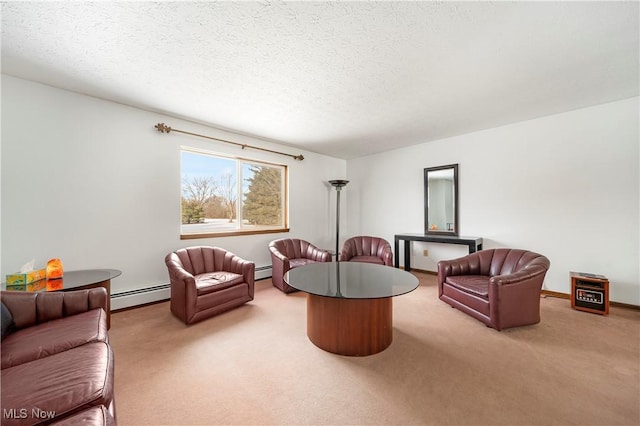 living room featuring a baseboard heating unit, a textured ceiling, and carpet