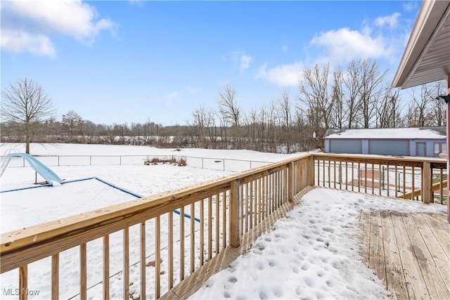 view of snow covered deck