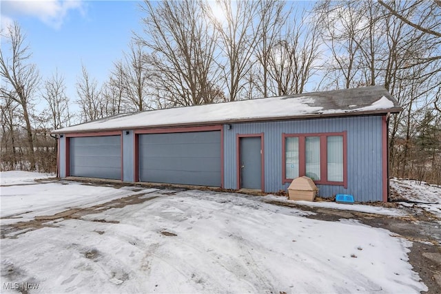 view of snow covered garage