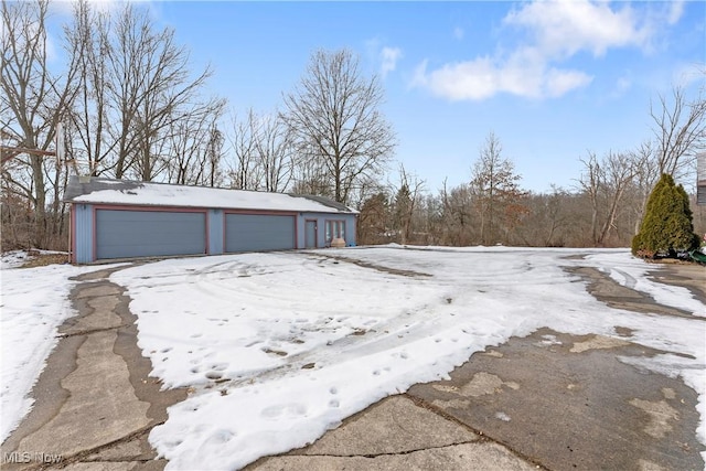 view of snow covered garage