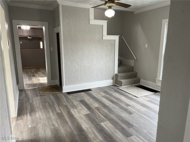 interior space with crown molding, wood-type flooring, and ceiling fan