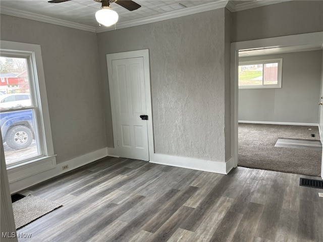 empty room with crown molding, ceiling fan, and hardwood / wood-style floors