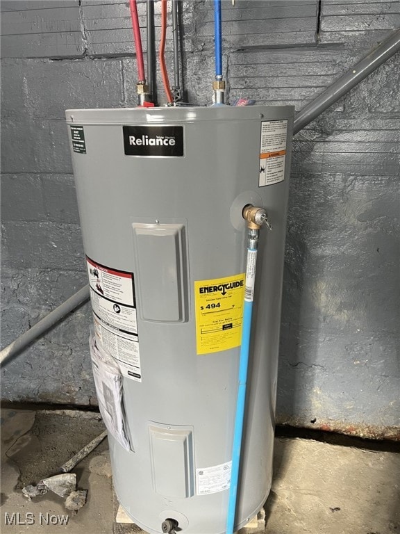 utility room featuring electric water heater