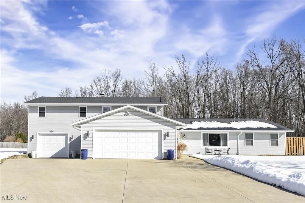 front facade with a garage