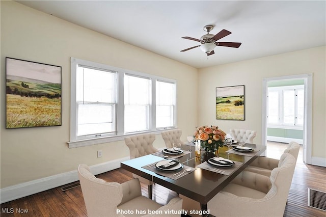 dining area with dark hardwood / wood-style floors and ceiling fan