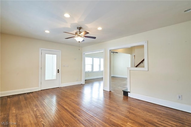 empty room featuring ceiling fan and wood-type flooring