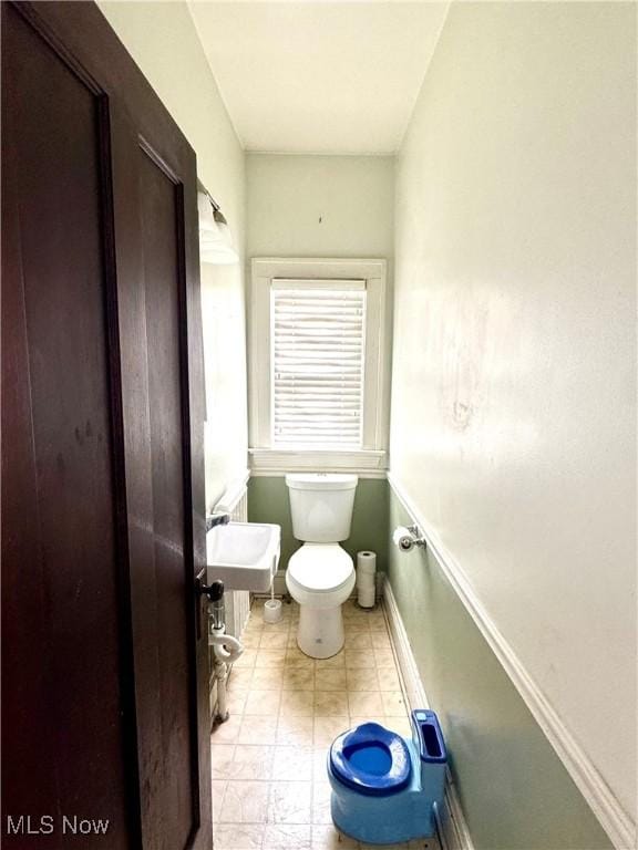 bathroom featuring toilet