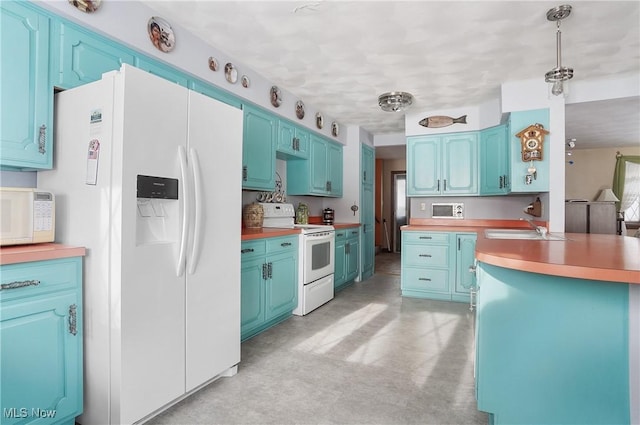 kitchen with butcher block countertops, blue cabinets, sink, hanging light fixtures, and white appliances