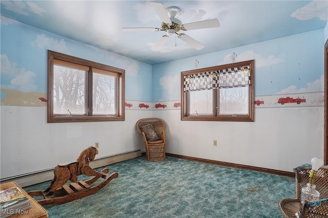 living area featuring ceiling fan and carpet