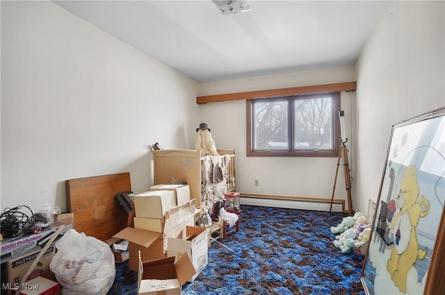 interior space featuring a baseboard heating unit and carpet flooring