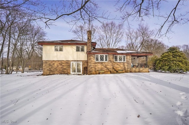 view of snow covered property