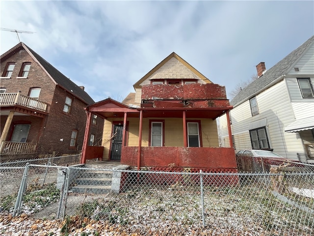 view of front of home with a balcony and covered porch