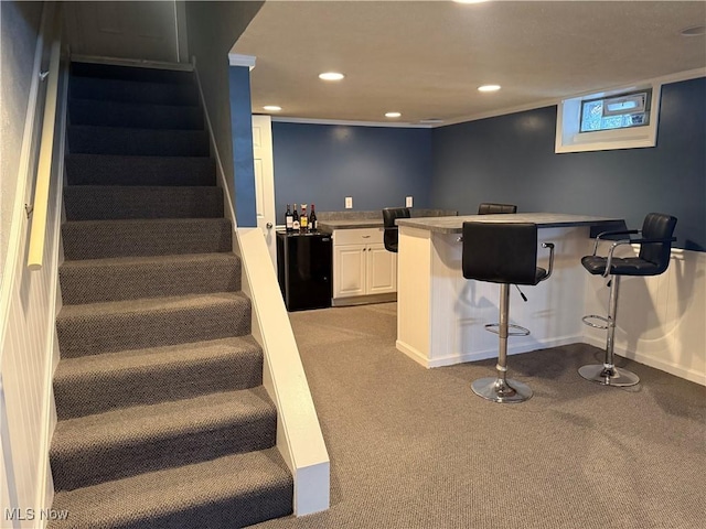 interior space with white cabinetry, light colored carpet, and refrigerator