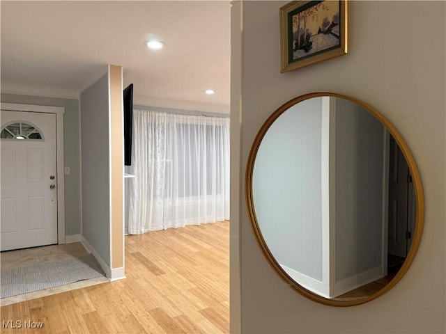 foyer entrance with light hardwood / wood-style floors