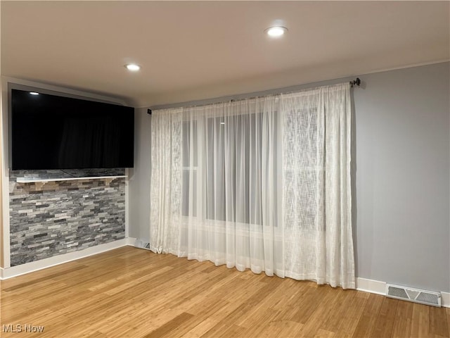 spare room with hardwood / wood-style flooring