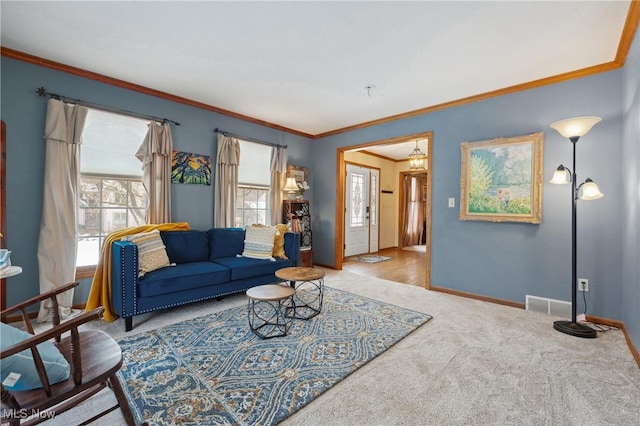 carpeted living room featuring ornamental molding