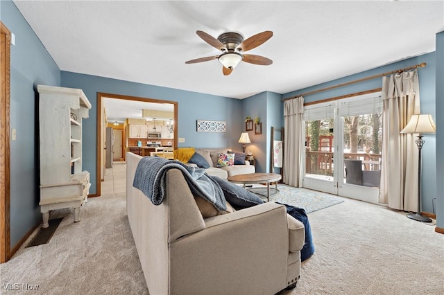 living room featuring ceiling fan and light carpet