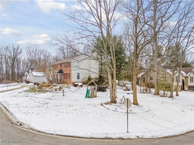 view of yard layered in snow