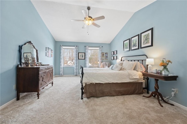 bedroom with vaulted ceiling, light colored carpet, and ceiling fan