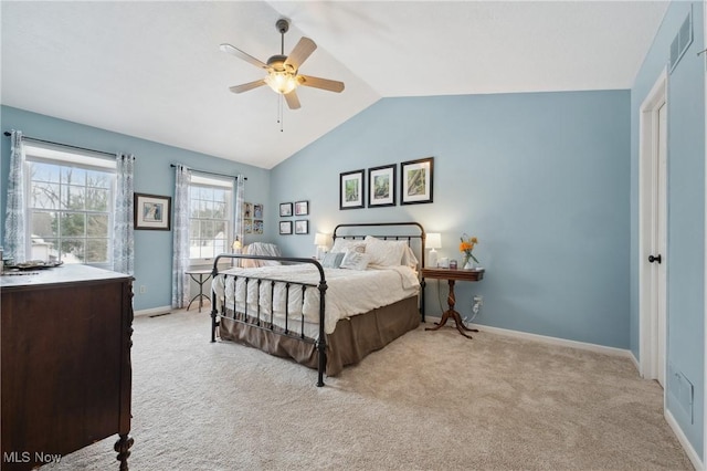 bedroom with ceiling fan, light colored carpet, and vaulted ceiling