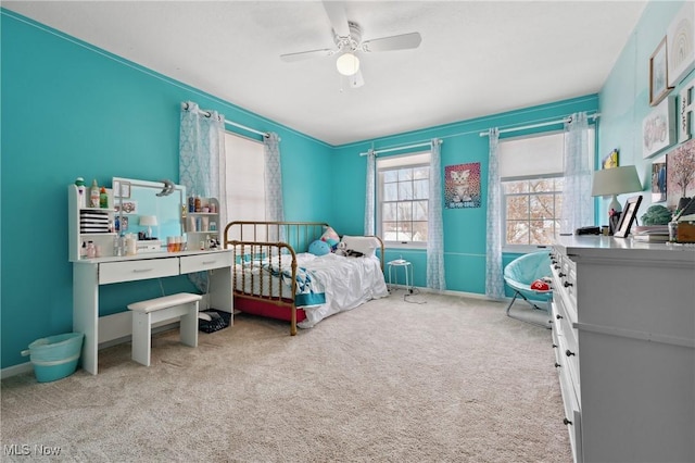 carpeted bedroom featuring ceiling fan