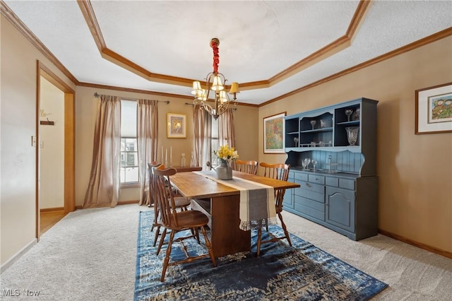 carpeted dining room with an inviting chandelier, crown molding, a raised ceiling, and a textured ceiling