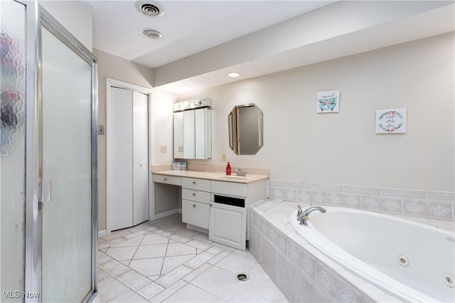 bathroom featuring vanity, tile patterned flooring, and independent shower and bath